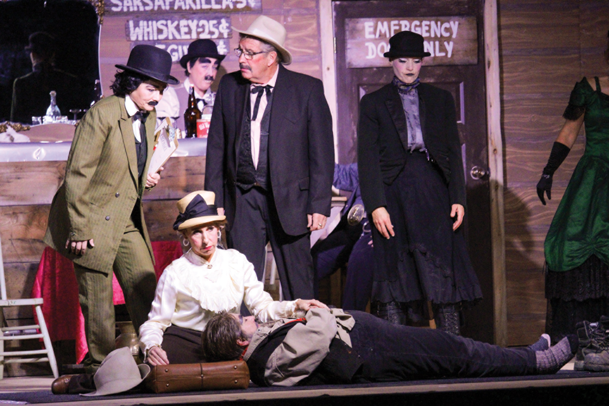 The cast of the Redvers Adult Drama Club performing The Day Black Bart Balderdash and Dangerous Dan McGrew Went to Dueling at Miss Kittys Golden Nugget Saloon.