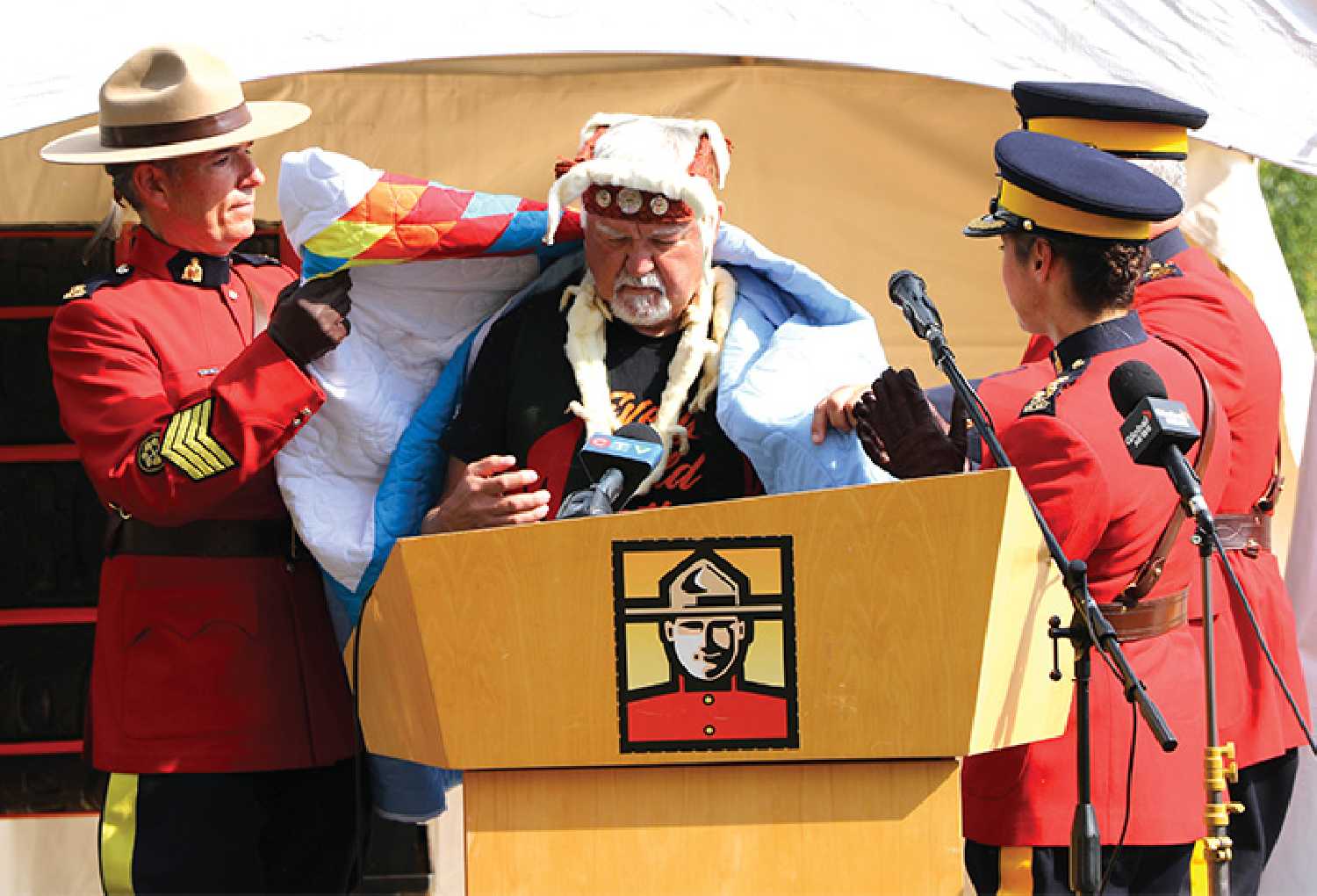  Ashley Bochek took of RCMP draping carver Stan Hunt with a star blanket, that will be part of a museum exhibit at the Canadian Museum of History based on the Residential School Memorial created by Hunt