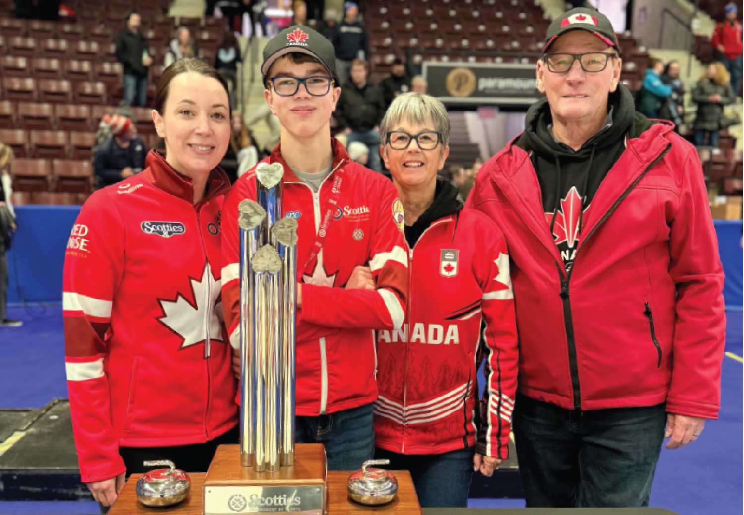 Val Sweeting, at left, with son Jaxen Nott and Marcia and Ross Sweeting after winning the Scotties Tournament of Hearts on Feb. 1.