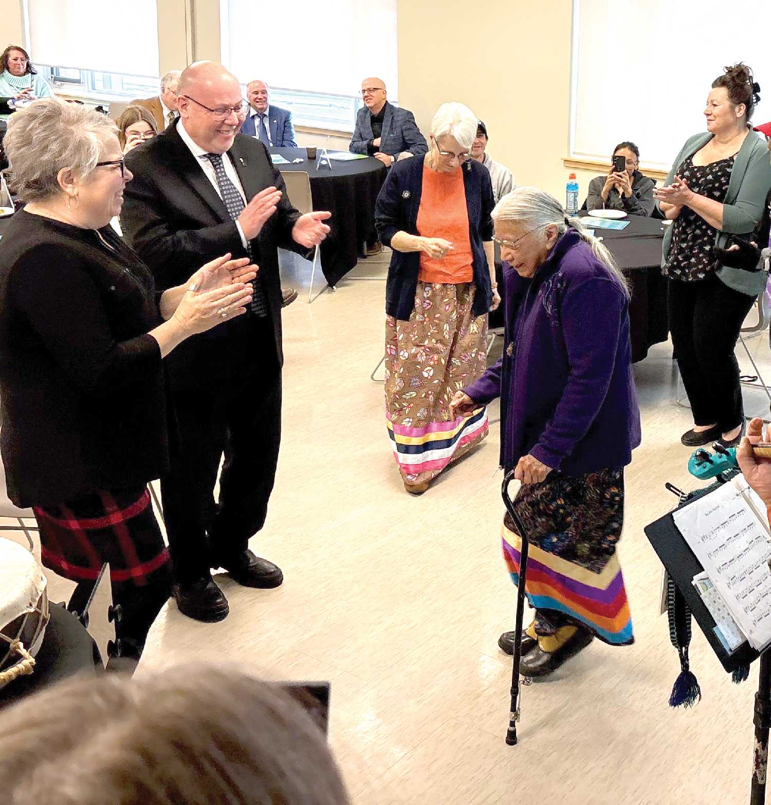 Elder Lorna Standingready couldnt resist getting up to dance as the AmberJacks provided some lively Mtis fiddle tunes.