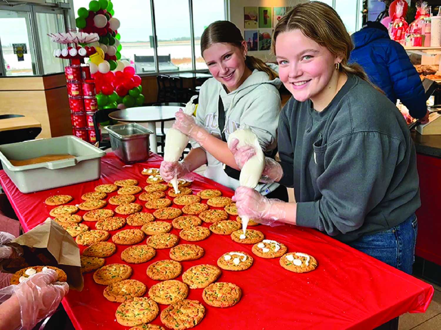 McNaughton High School students decorating Holiday Smile Cookies during the last Holiday Smile Cookie Week
